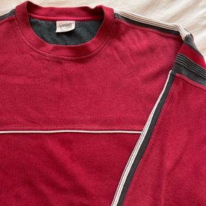 Red pull over worn once